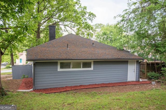 view of property exterior with a yard