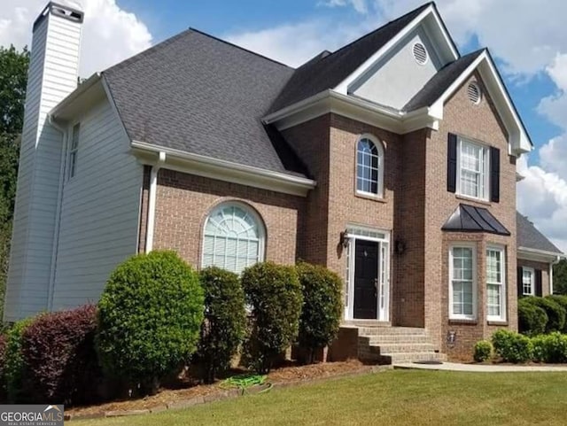 view of front property with a front lawn