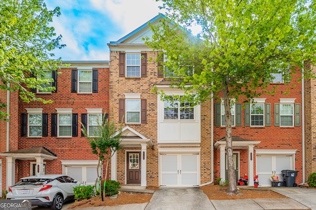 multi unit property featuring a garage