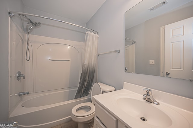 full bathroom featuring vanity, shower / bath combo with shower curtain, and toilet