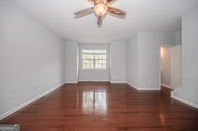 empty room featuring dark hardwood / wood-style floors and ceiling fan