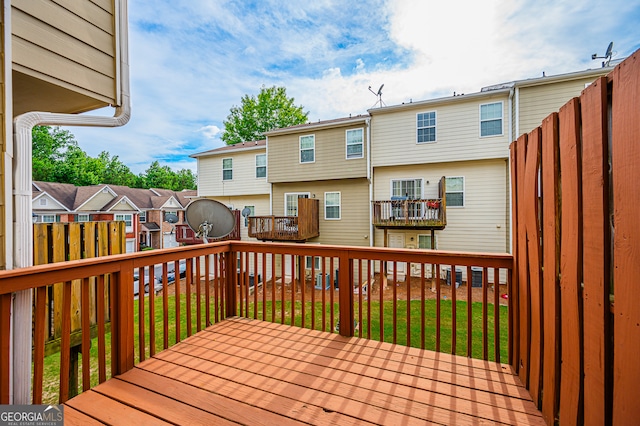 wooden deck with a yard