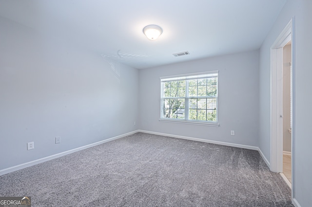 empty room featuring carpet flooring