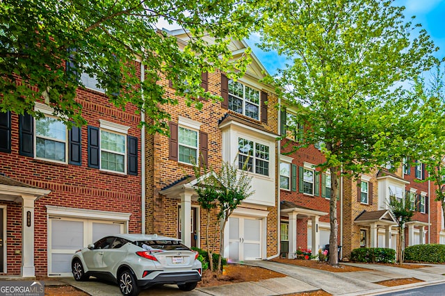 townhome / multi-family property featuring a garage