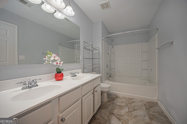 full bathroom with vanity, toilet, and shower / washtub combination