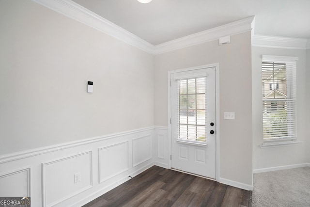 doorway featuring a healthy amount of sunlight, crown molding, and dark wood-type flooring