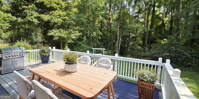 wooden deck with outdoor dining space