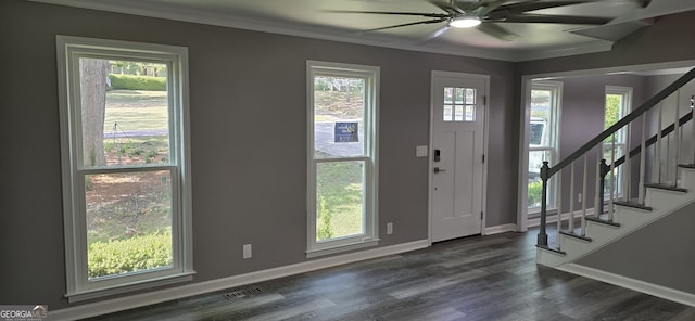 foyer entrance with a healthy amount of sunlight, dark wood-style floors, stairs, and visible vents