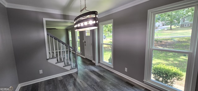 entryway featuring baseboards, dark wood finished floors, and crown molding