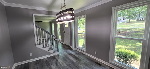 5124 Smoke Rise Dr, Macon, GA 31210 - foyer entrance with healthy amount of natural light, stairs, dark wood-style floors, and ornamental molding