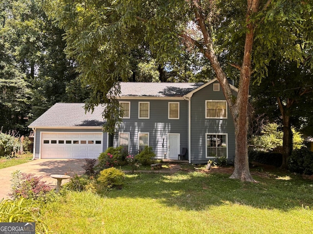 view of front of home with a garage and a front yard