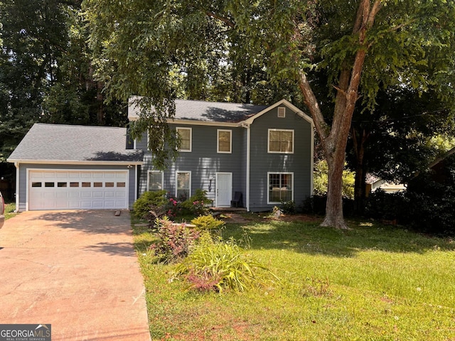 view of front of home with a garage and a front yard