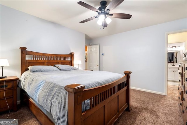 bedroom with dark colored carpet, ensuite bathroom, and ceiling fan