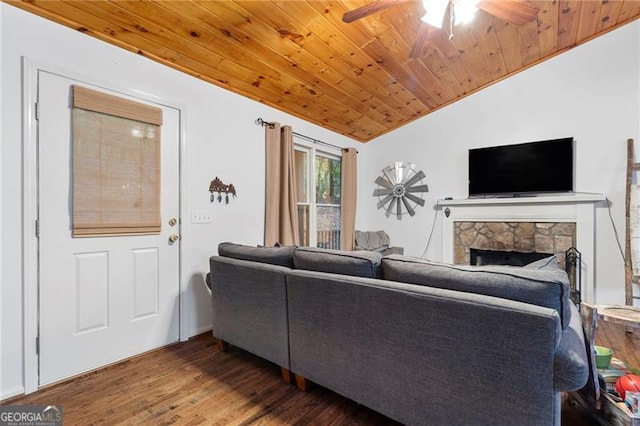 living room with ceiling fan, wooden ceiling, a stone fireplace, vaulted ceiling, and hardwood / wood-style flooring