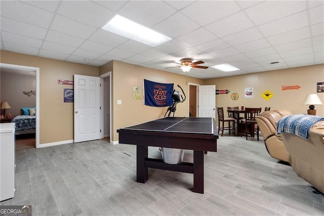 playroom featuring a paneled ceiling and ceiling fan