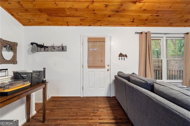 interior space with lofted ceiling, wood ceiling, and dark wood-type flooring