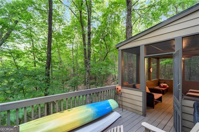 wooden terrace featuring a sunroom