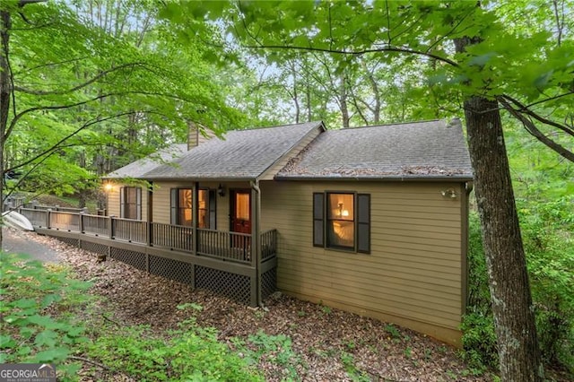 back of house featuring a deck