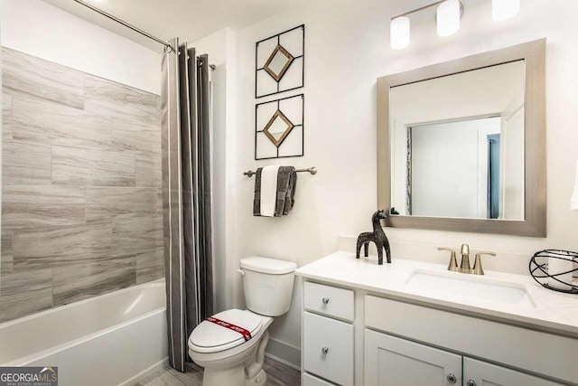 full bathroom featuring shower / bath combination with curtain, vanity, and toilet