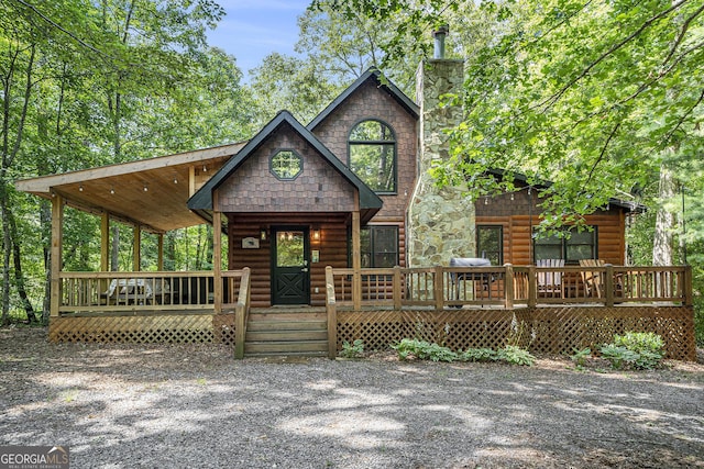 log-style house with a porch