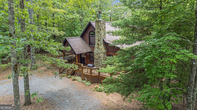 view of side of property featuring a deck