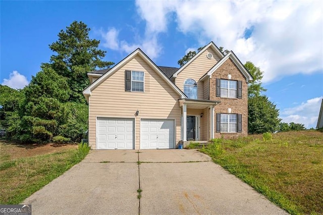 front of property featuring a garage and a front lawn