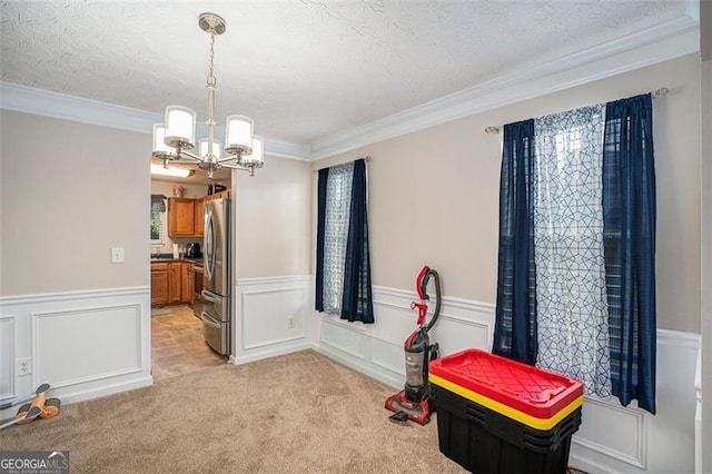 interior space featuring crown molding, a textured ceiling, and an inviting chandelier