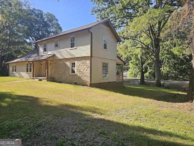 back of house with a yard