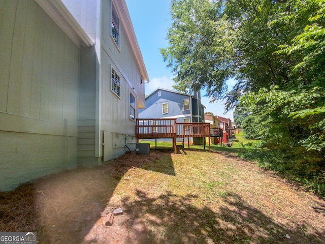 view of yard featuring a wooden deck