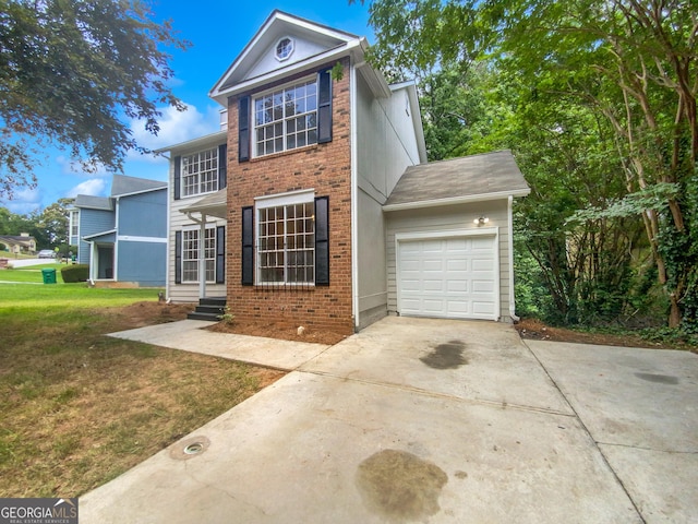 view of front facade featuring a garage and a front lawn