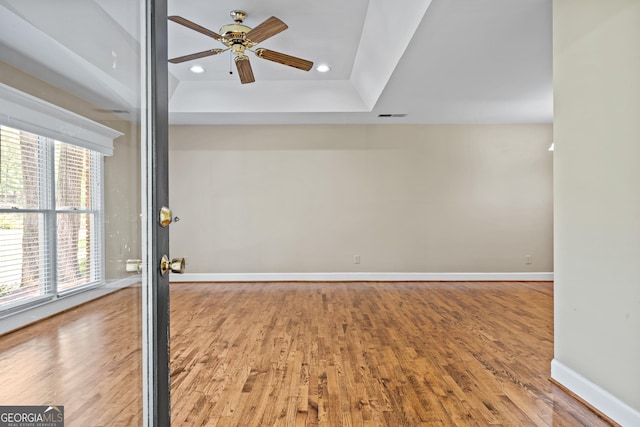 spare room with ceiling fan, light hardwood / wood-style flooring, and plenty of natural light