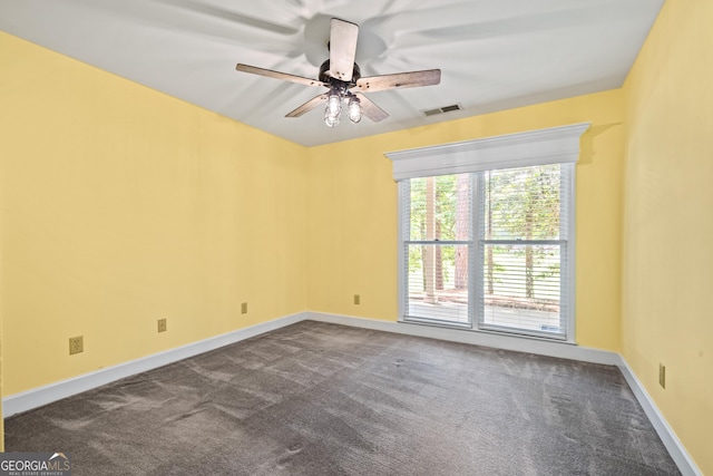 unfurnished room featuring ceiling fan and carpet floors