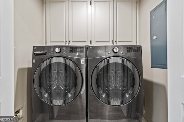 washroom with cabinets and separate washer and dryer