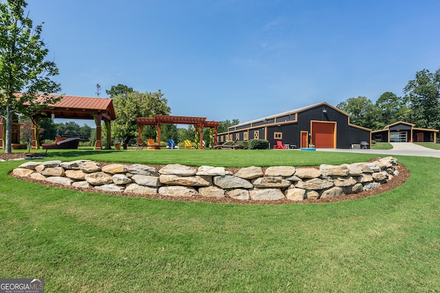 view of yard with a pergola, a gazebo, an outdoor structure, and a garage