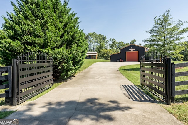 view of gate with an outdoor structure