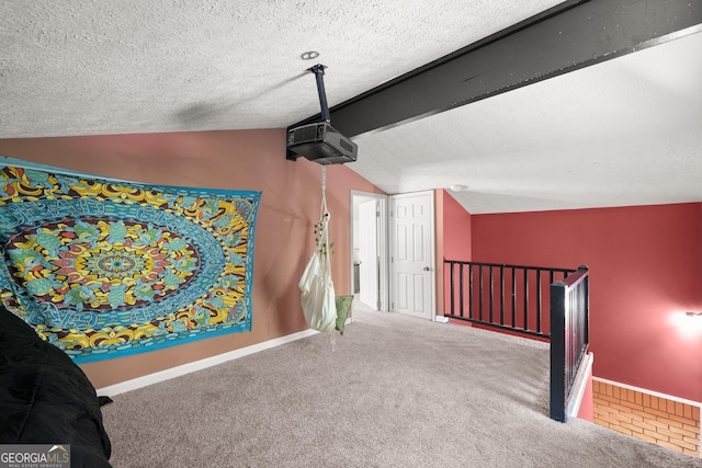 bonus room featuring a textured ceiling, carpet, and lofted ceiling