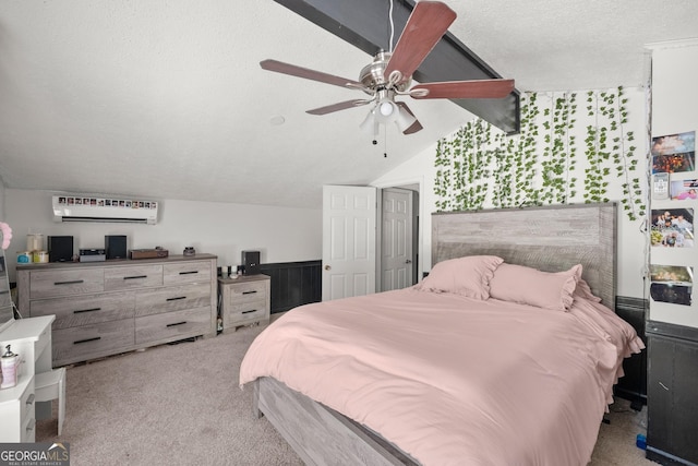 carpeted bedroom featuring ceiling fan, lofted ceiling, a textured ceiling, and a wall unit AC