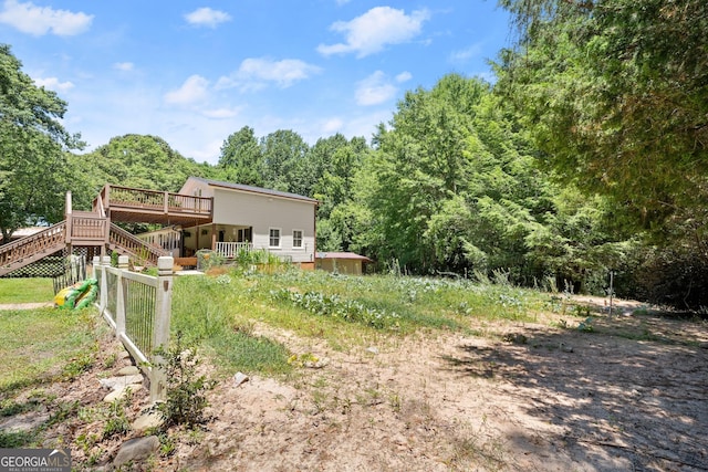 view of yard with a wooden deck