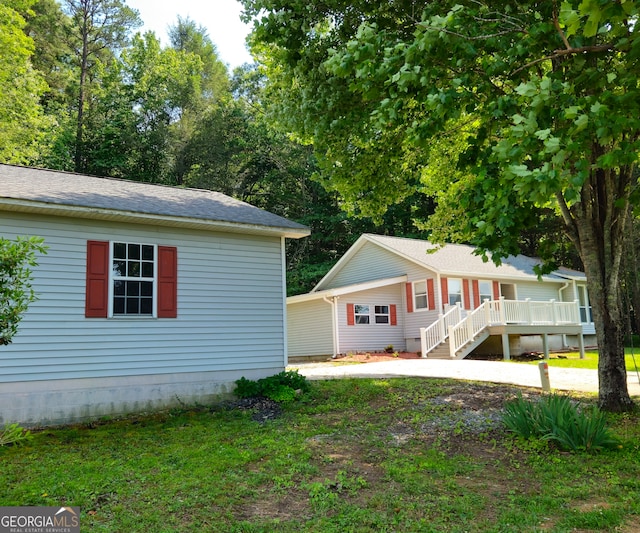 view of side of home with a deck