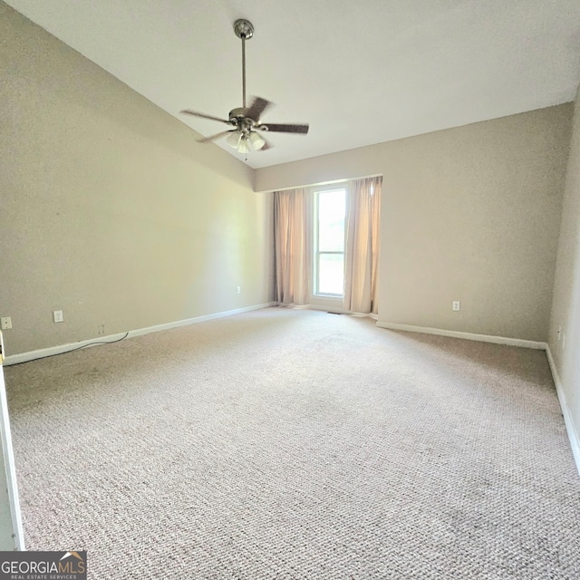 spare room with ceiling fan and carpet floors