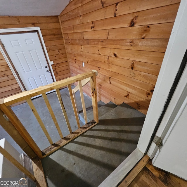 staircase with lofted ceiling