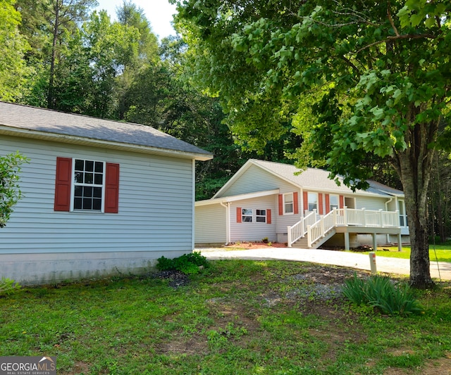 view of side of home featuring a yard