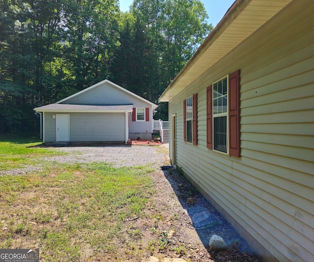 view of yard with a garage and an outdoor structure