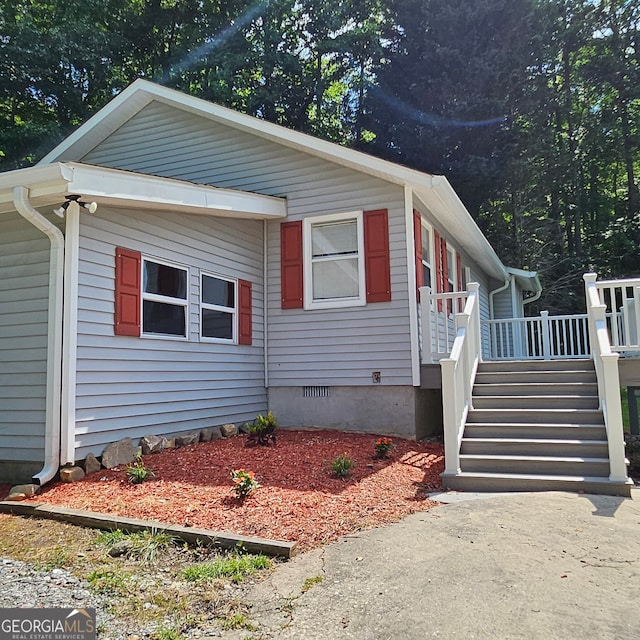 view of front of house with a wooden deck