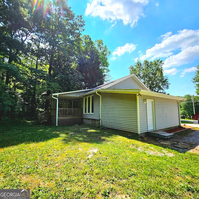 view of home's exterior featuring a yard