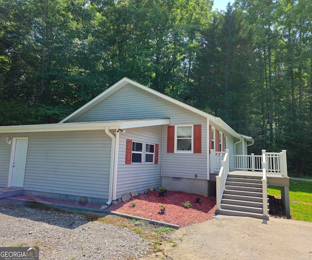 view of front of property featuring a wooden deck