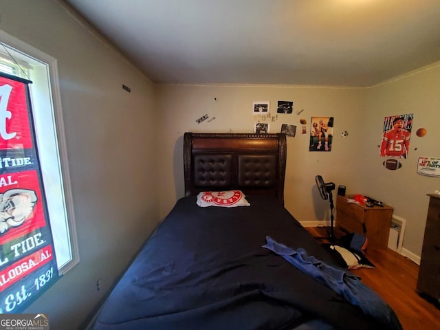 bedroom featuring hardwood / wood-style flooring