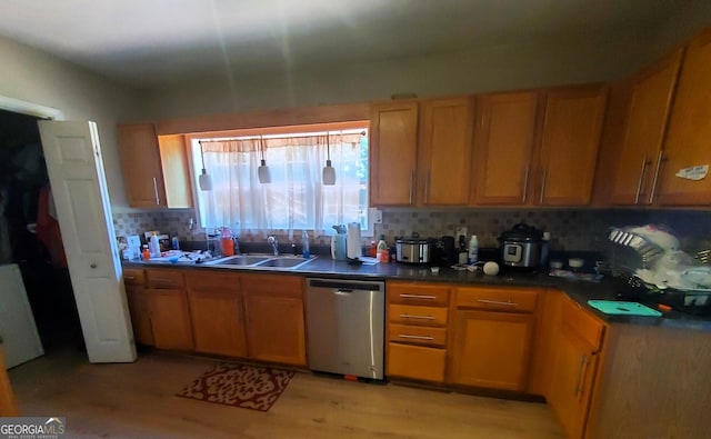 kitchen with sink, stainless steel dishwasher, light wood-type flooring, and tasteful backsplash