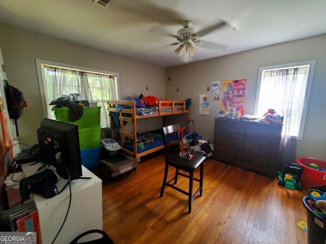 bedroom featuring ceiling fan and hardwood / wood-style floors