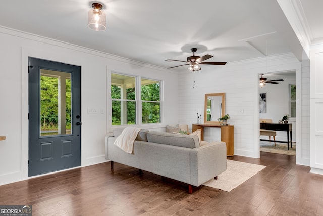 living room featuring dark hardwood / wood-style flooring, a wealth of natural light, and ceiling fan